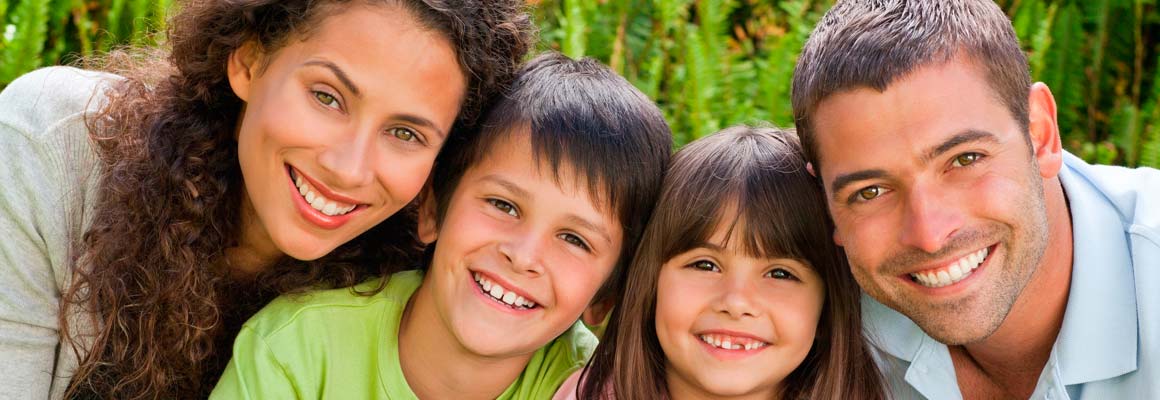 Smiling family of four